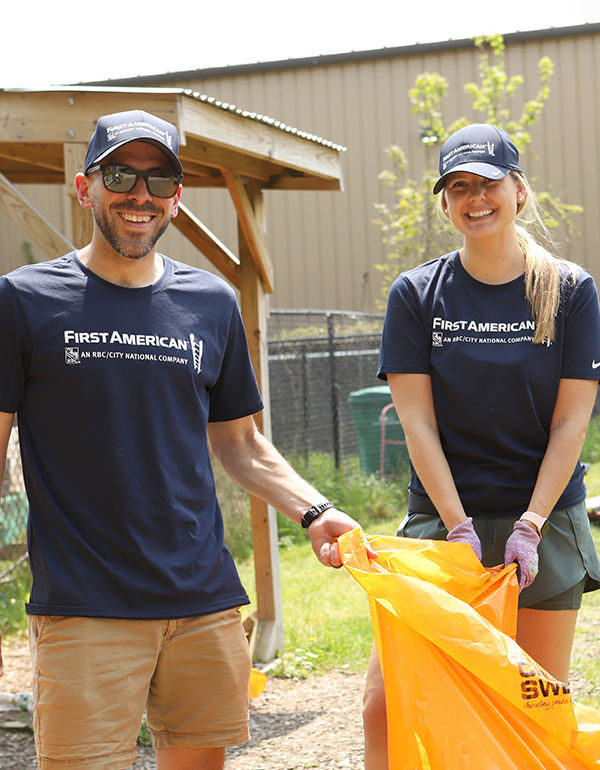 First American colleagues complete yard work at a local non profit